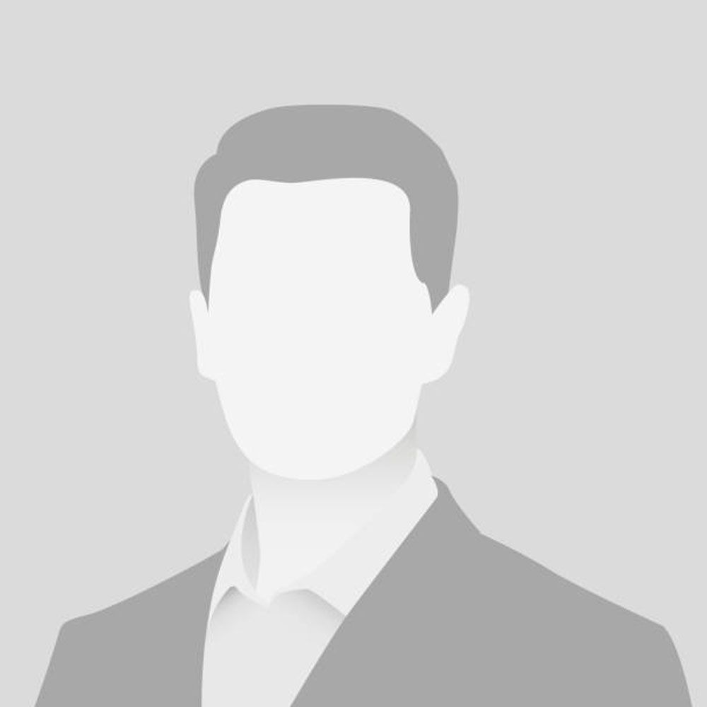 Silhouette of a male in a suit, generic avatar for profile picture or placeholder image.